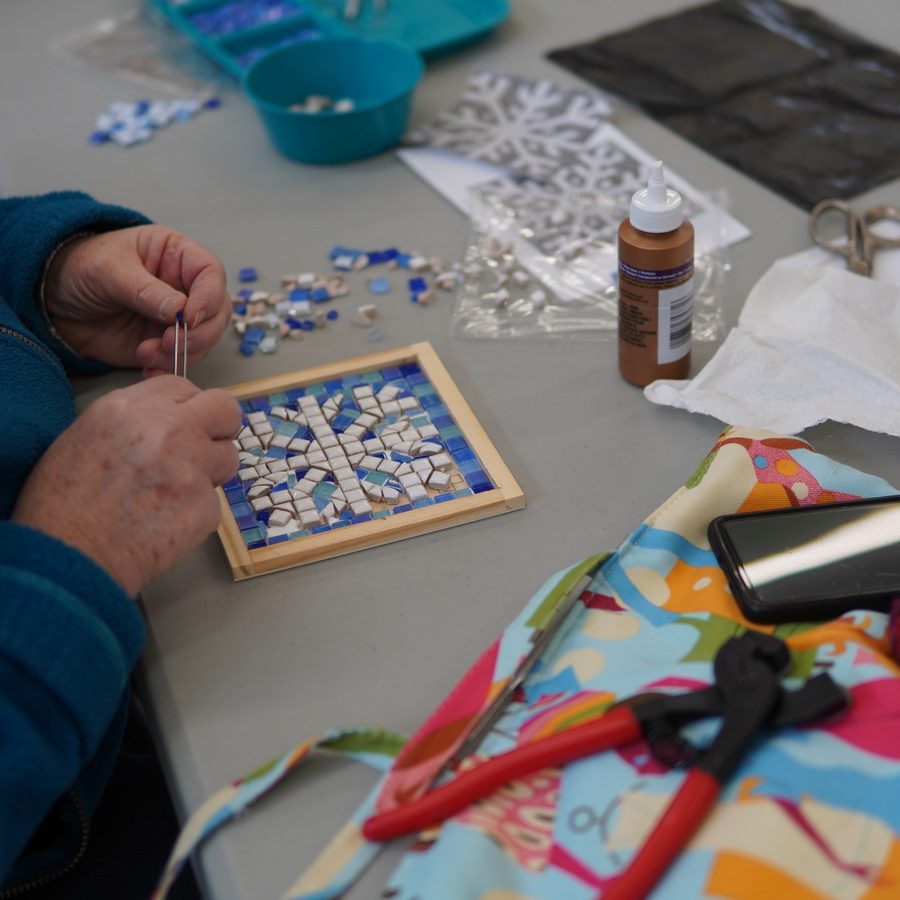Mosaic workshop — setting glass tesserae into a small framed snowflake